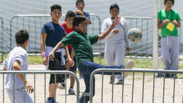 Migrant children play soccer inside the Homestead Temporary Shelter for Unaccompanied Children in Homestead, Florida, on April 19, 2019. 